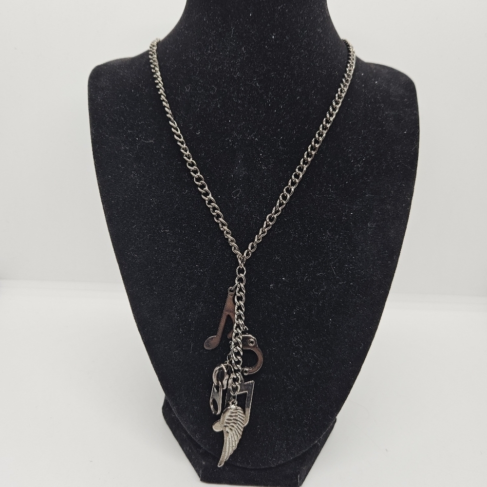 Claires gunmetal chain necklace with music notes handcuff zipper angel wing